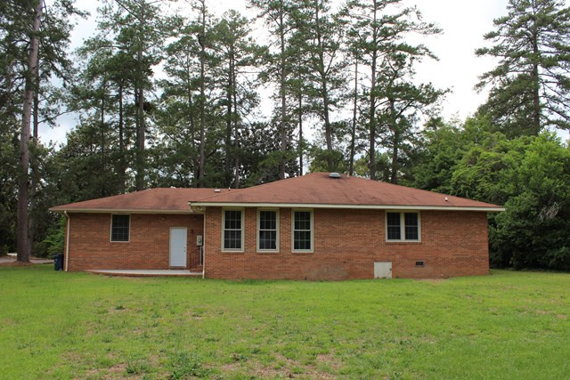 1148 Whiskey Road Aiken, SC 29801 - Photo 16 of 20 a view of a yard in front of a house with large tree