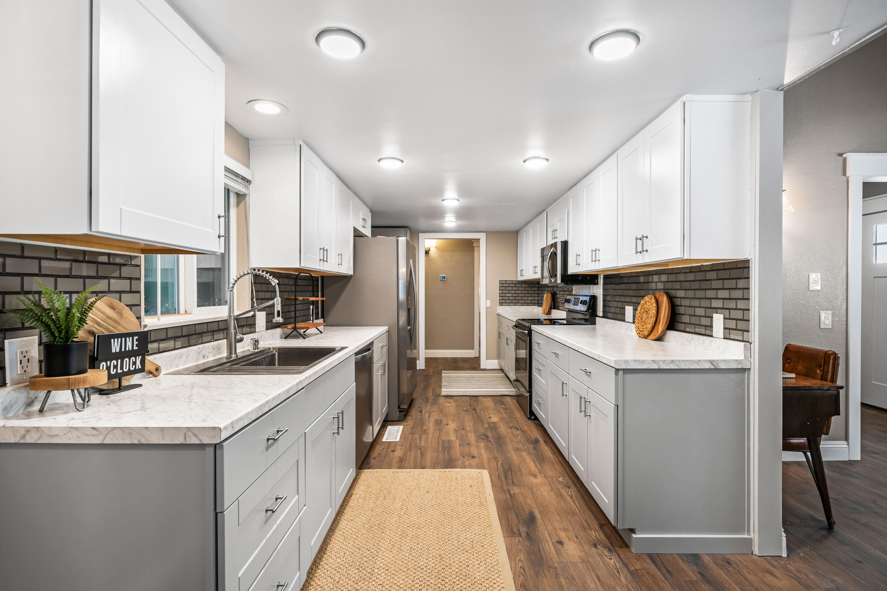 8631 Prospectors Road Redding, CA 96001 - Photo 21 of 41 a kitchen with granite countertop a sink stove refrigerator and cabinets