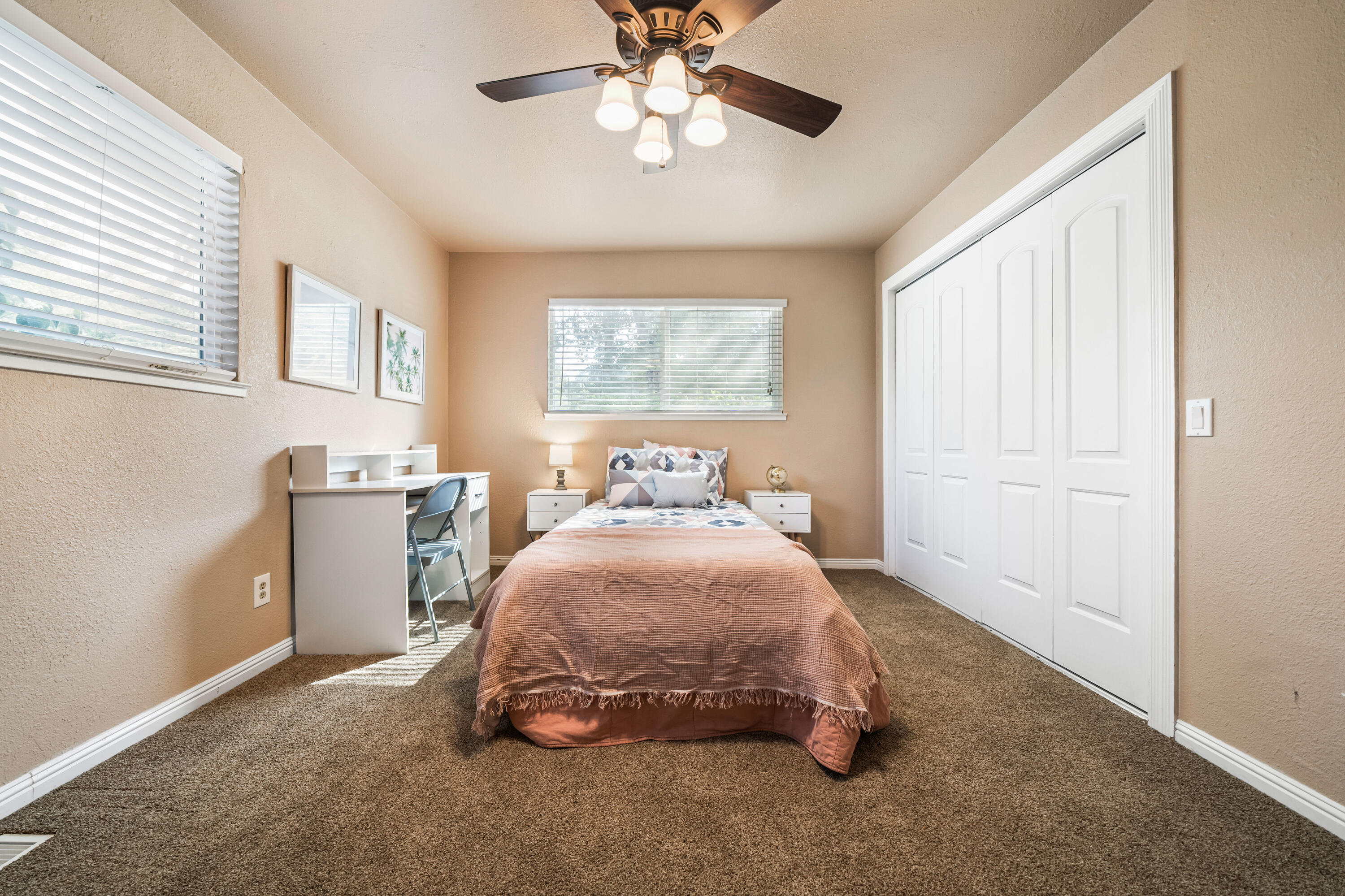 8631 Prospectors Road Redding, CA 96001 - Photo 28 of 41 a spacious bedroom with a bed and a chandelier