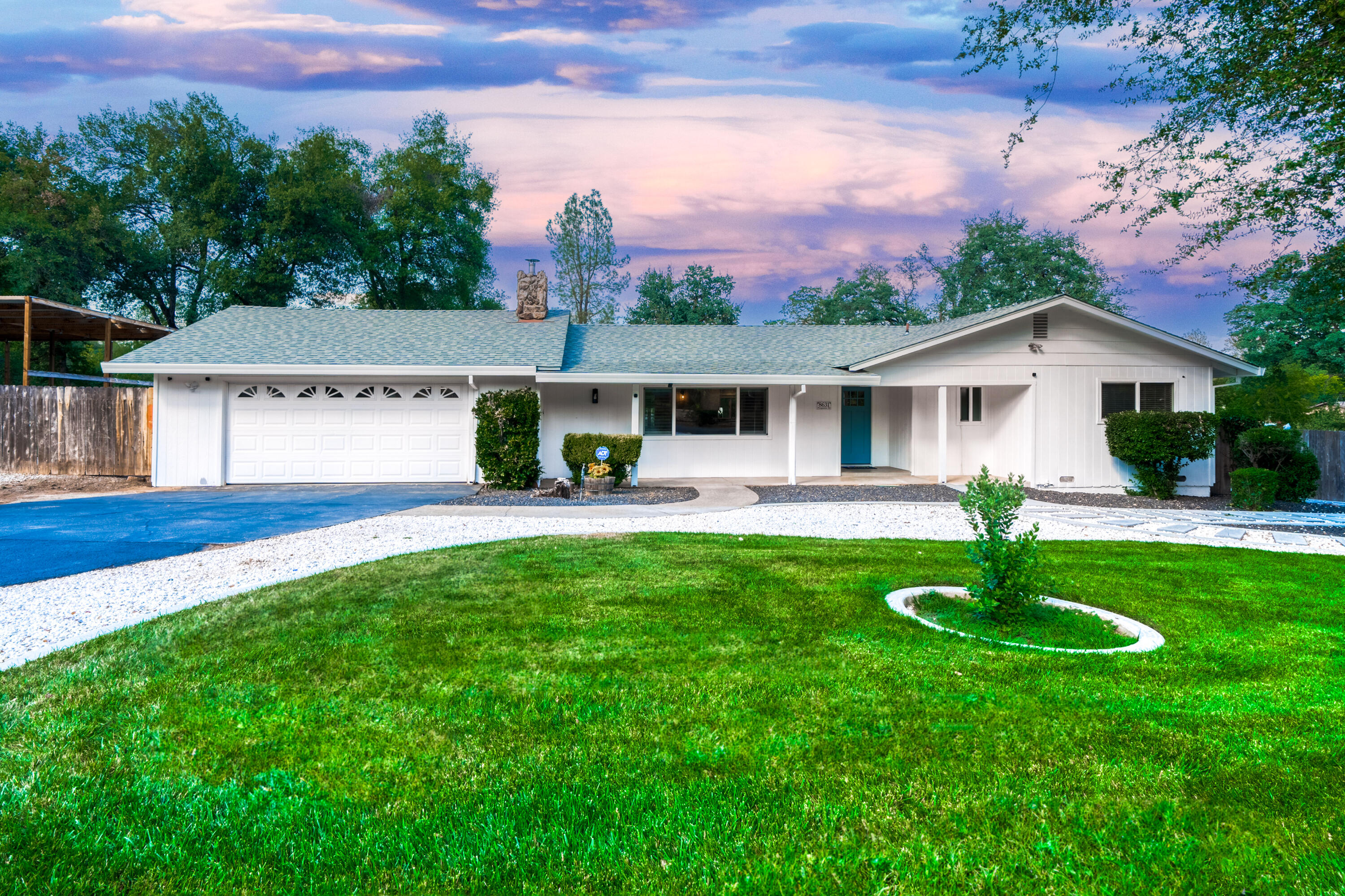 8631 Prospectors Road Redding, CA 96001 - Photo 6 of 41 a front view of a house with a yard and green space