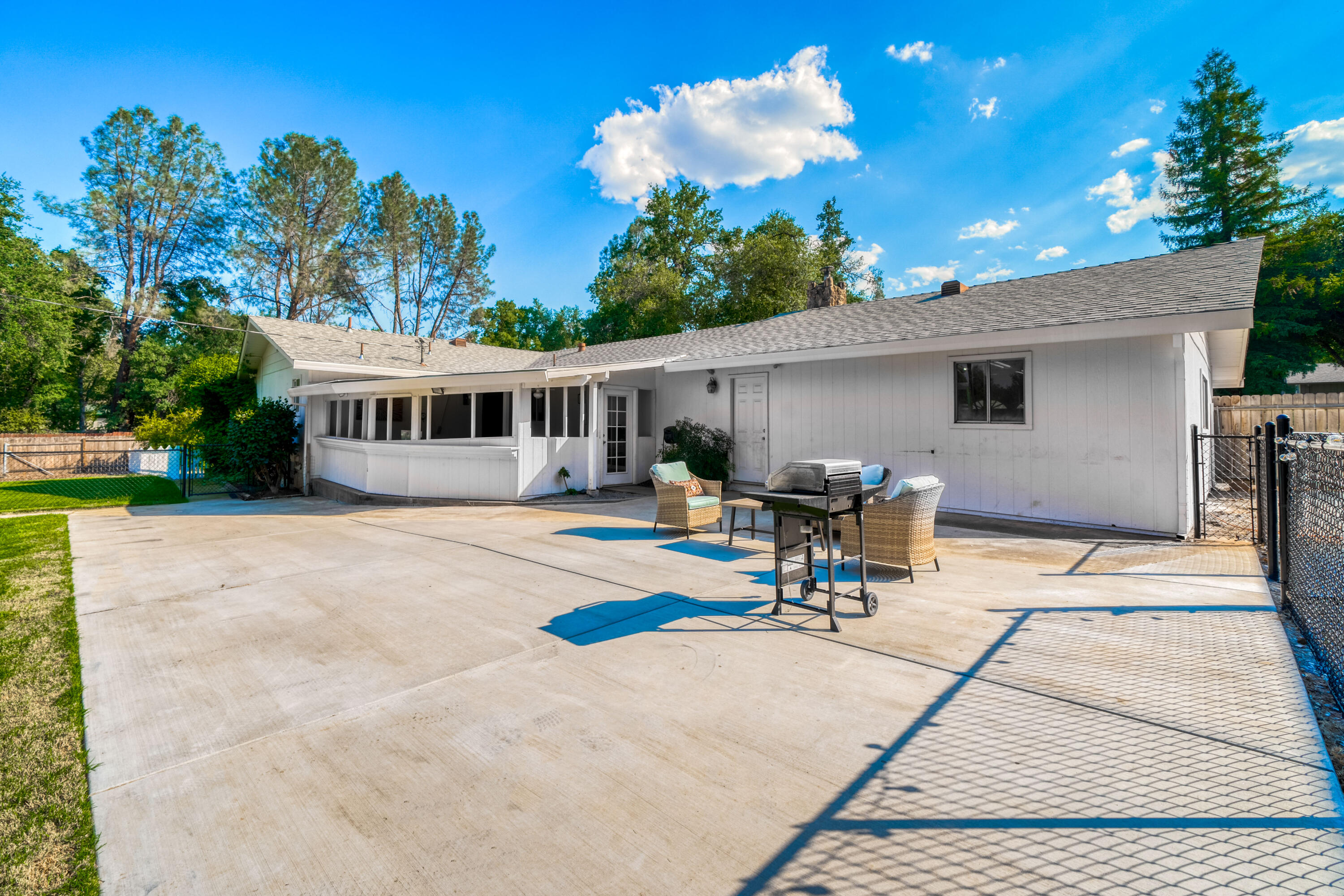 8631 Prospectors Road Redding, CA 96001 - Photo 8 of 41 a view of a house with sitting area and furniture