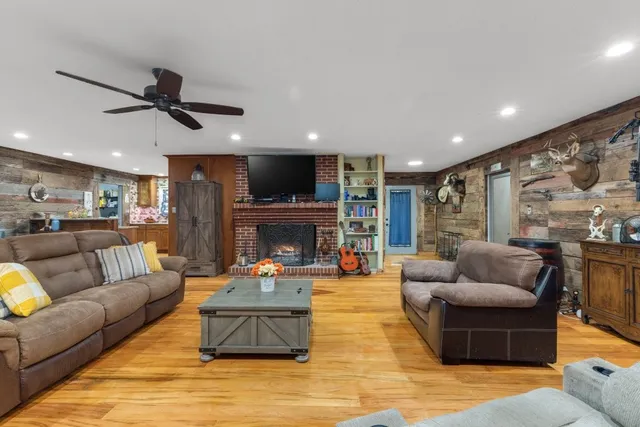 a dining room with furniture and wooden floor