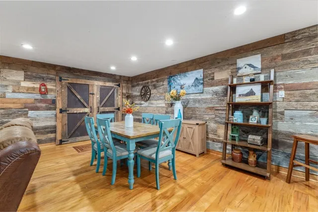 a bedroom with double bed and a chandelier