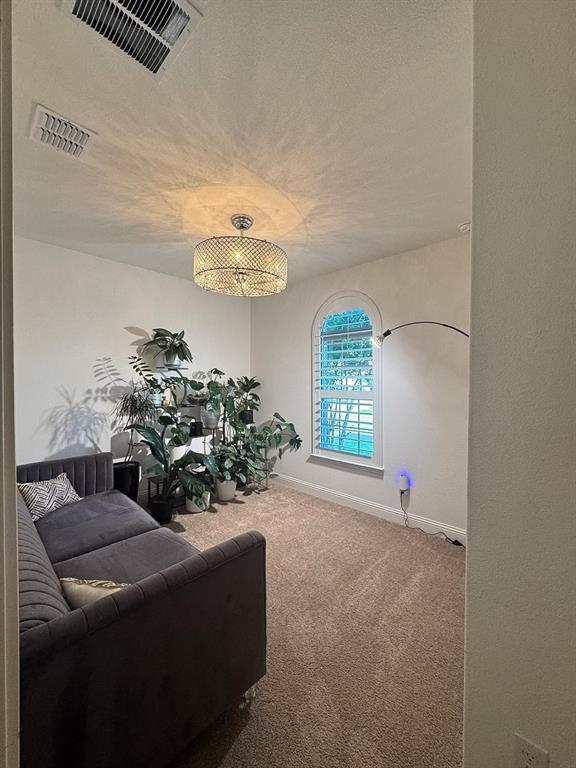 7024 Tree Stand Point Little Elm, TX 76227 - Photo 17 of 30 a living room with furniture and a window