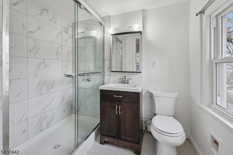 24 Franklin Place Summit, NJ 07901 - Photo 13 of 36 a bathroom with a toilet sink shower and mirror