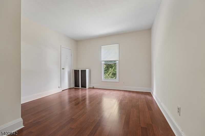 24 Franklin Place Summit, NJ 07901 - Photo 16 of 36 a view of a big room with wooden floor and windows