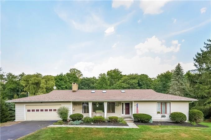 4 Winslow Road Newtown, CT 06470 - Photo 1 of 1 a view of a white house with a big yard and potted plants