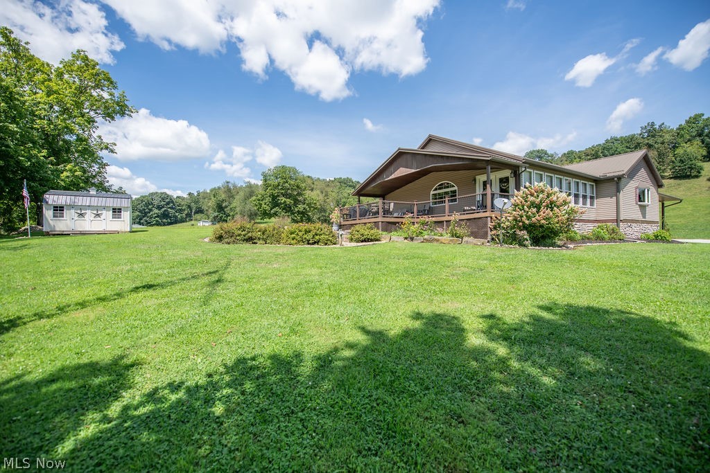 48800 Foxes Bottom Road Cadiz, OH 43907 - Photo 6 of 50 Side exterior view of home featuring patio area