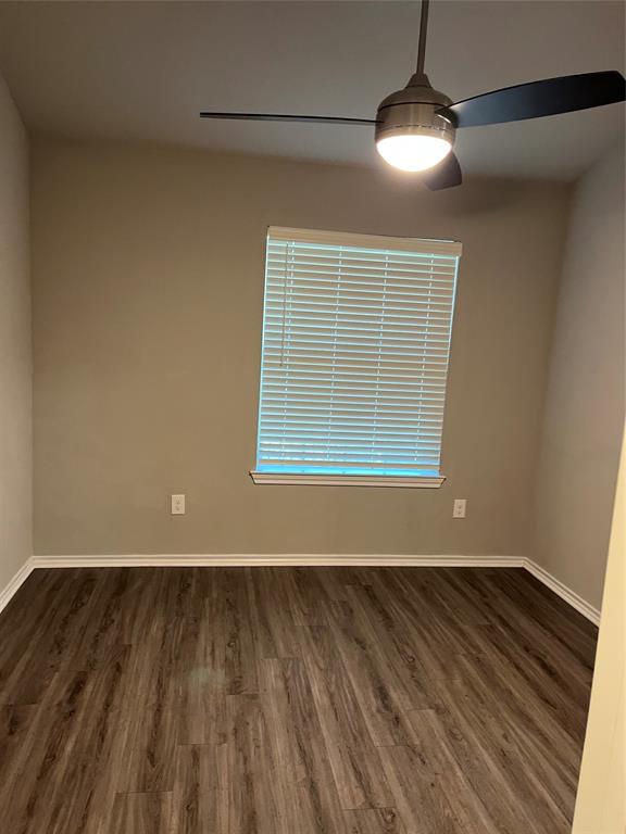 6108 Abrams Road, Unit 528 Dallas, TX 75231 - Photo 3 of 7 bedroom featuring dark wood finished floors and a ceiling fan