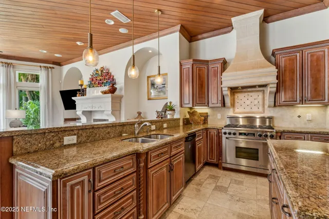 a large bathroom with a granite countertop tub a sink and a large window