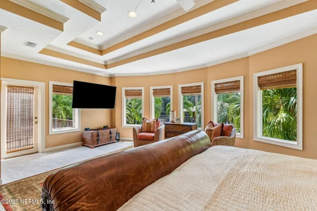 a bathroom with a large tub shower and sink
