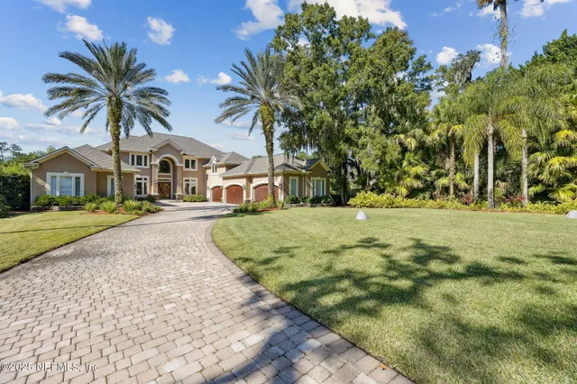 a view of a backyard of the house