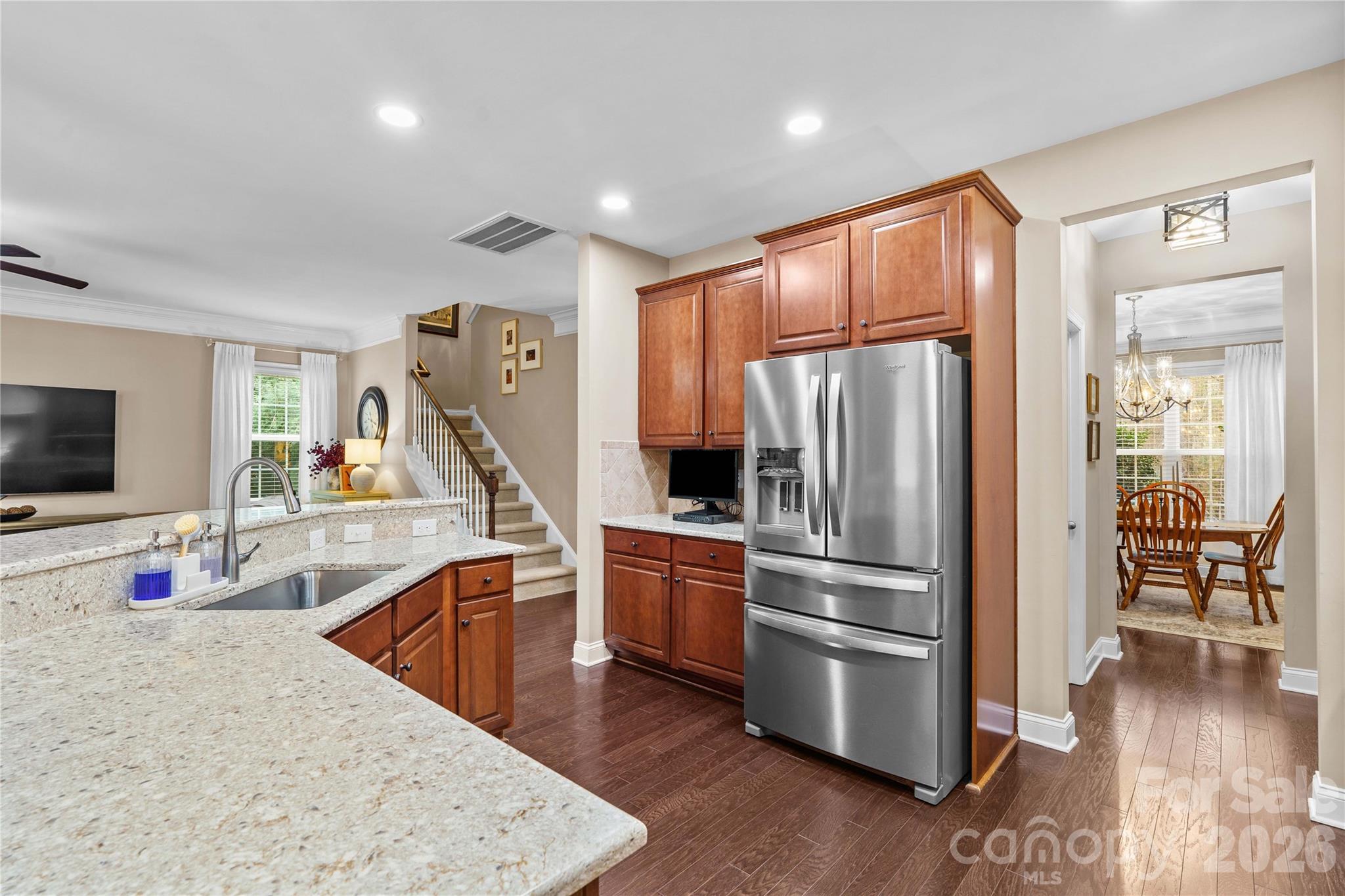106 Dayvault Cut Road Troutman, NC 28166 - Photo 13 of 48 a kitchen with stainless steel appliances granite countertop a refrigerator and a sink
