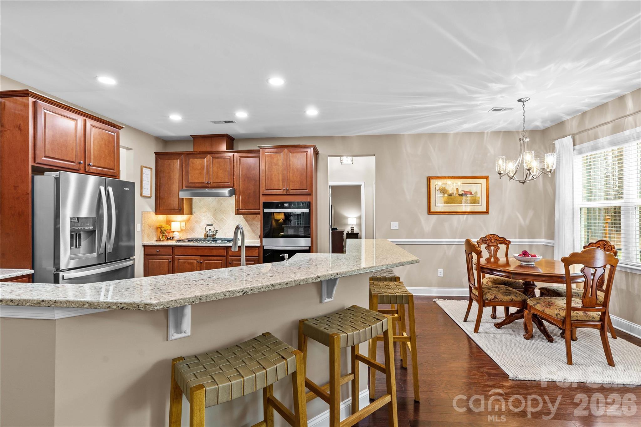 106 Dayvault Cut Road Troutman, NC 28166 - Photo 15 of 48 a large kitchen with lots of counter space and breakfast area