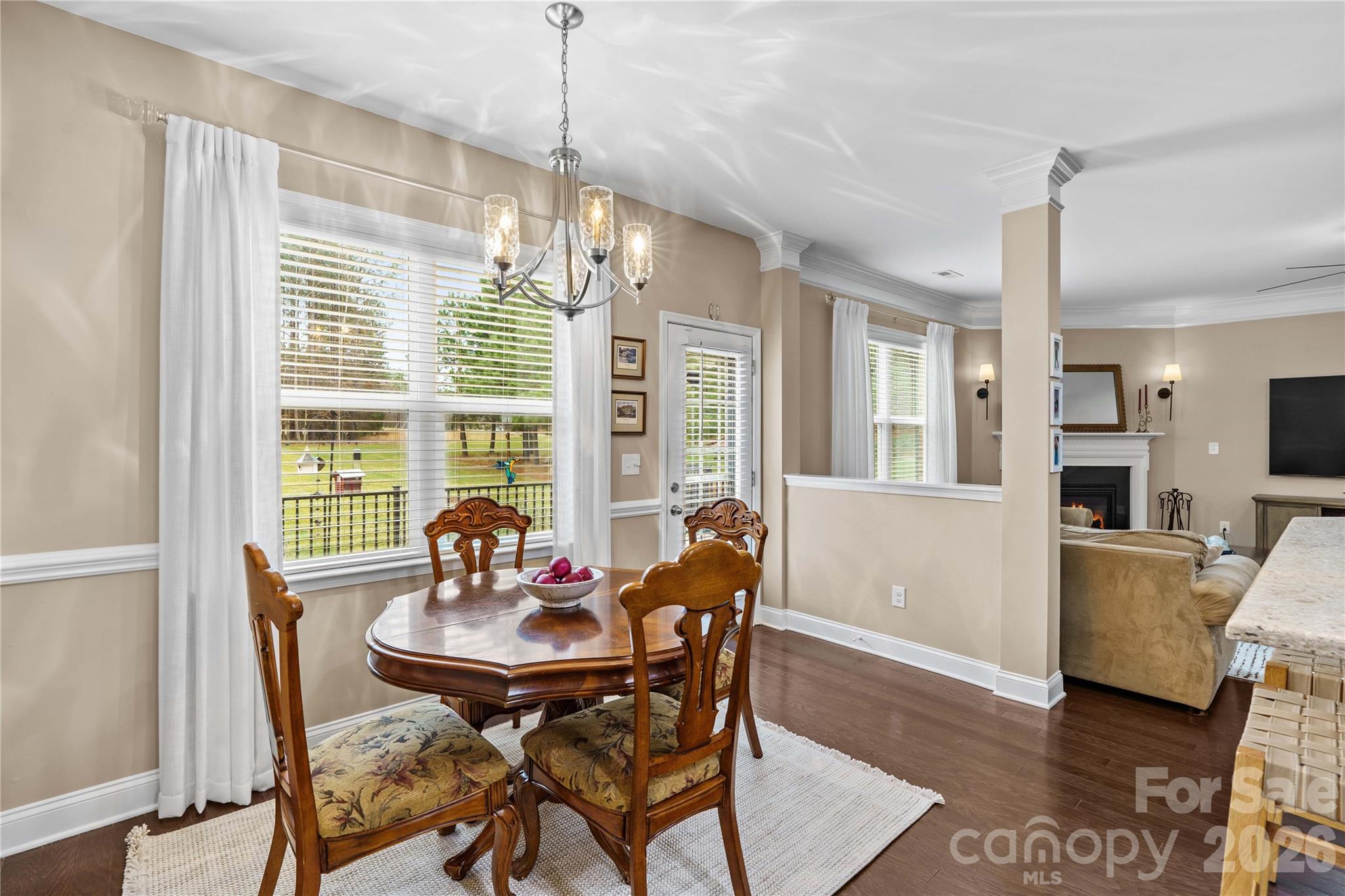 106 Dayvault Cut Road Troutman, NC 28166 - Photo 17 of 48 a dining room with furniture a chandelier and wooden floor