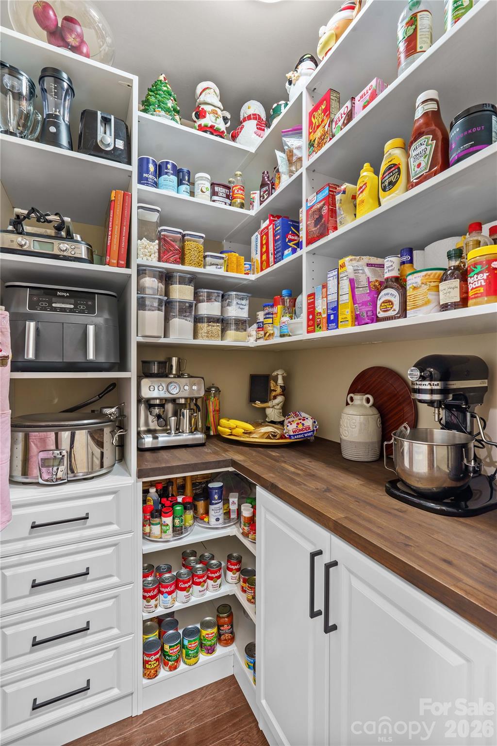 106 Dayvault Cut Road Troutman, NC 28166 - Photo 18 of 48 a kitchen with lots of clutter and cabinets