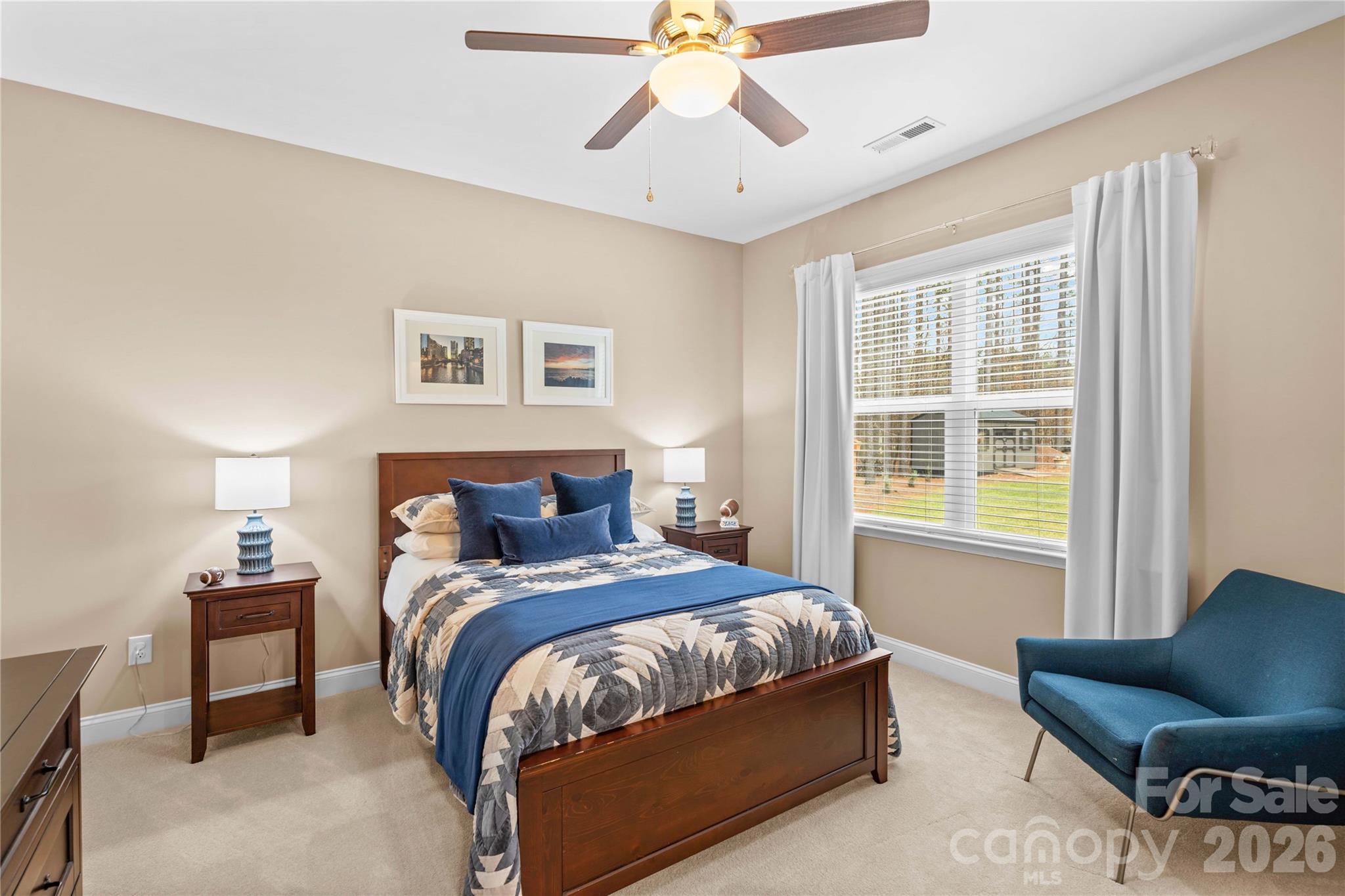 106 Dayvault Cut Road Troutman, NC 28166 - Photo 23 of 48 a bedroom with a bed and chair