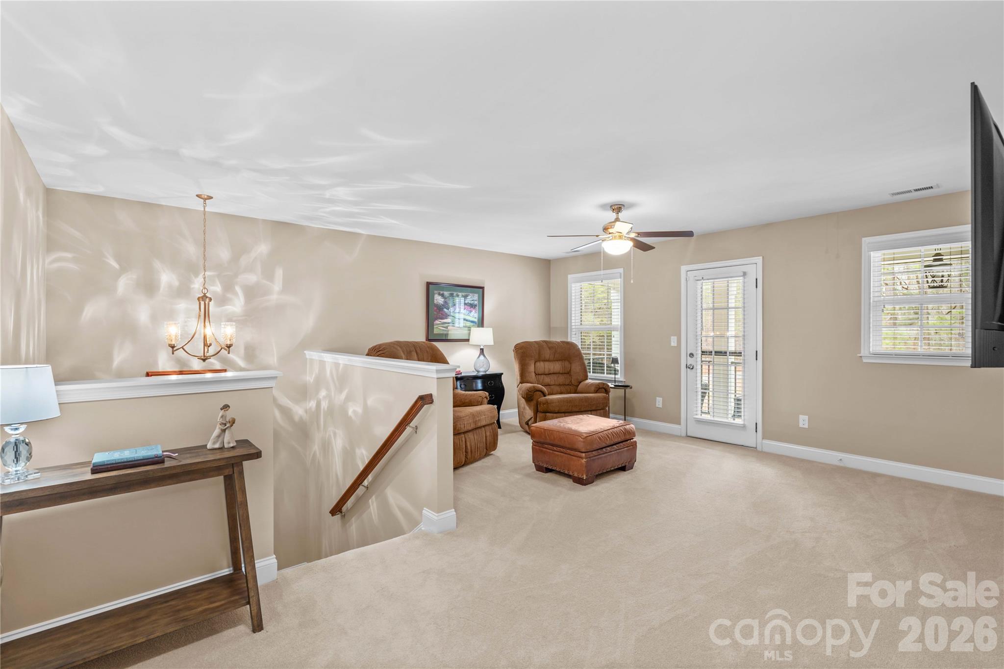 106 Dayvault Cut Road Troutman, NC 28166 - Photo 26 of 48 a living room with furniture and a chandelier
