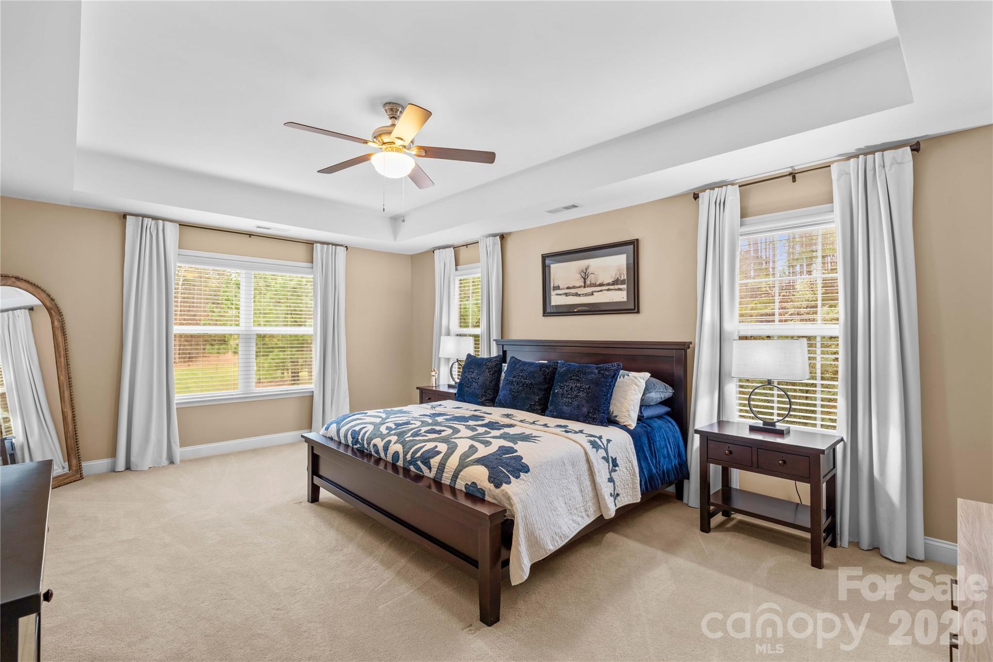 106 Dayvault Cut Road Troutman, NC 28166 - Photo 28 of 48 a bed sitting in a bedroom next to a window