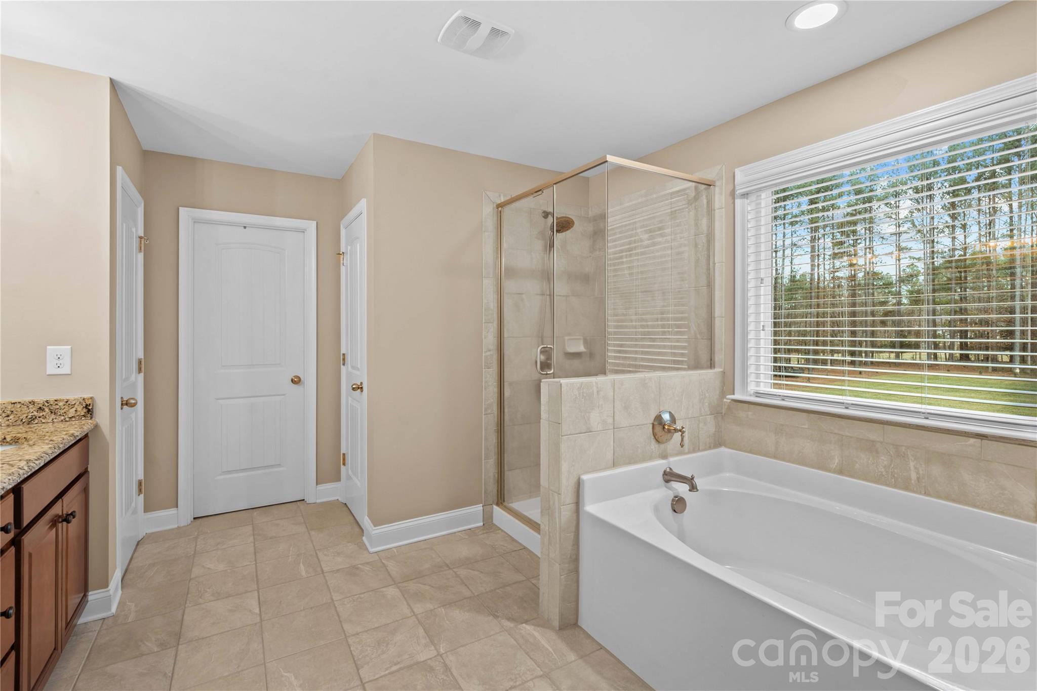 106 Dayvault Cut Road Troutman, NC 28166 - Photo 31 of 48 a bathroom with a tub shower and sink