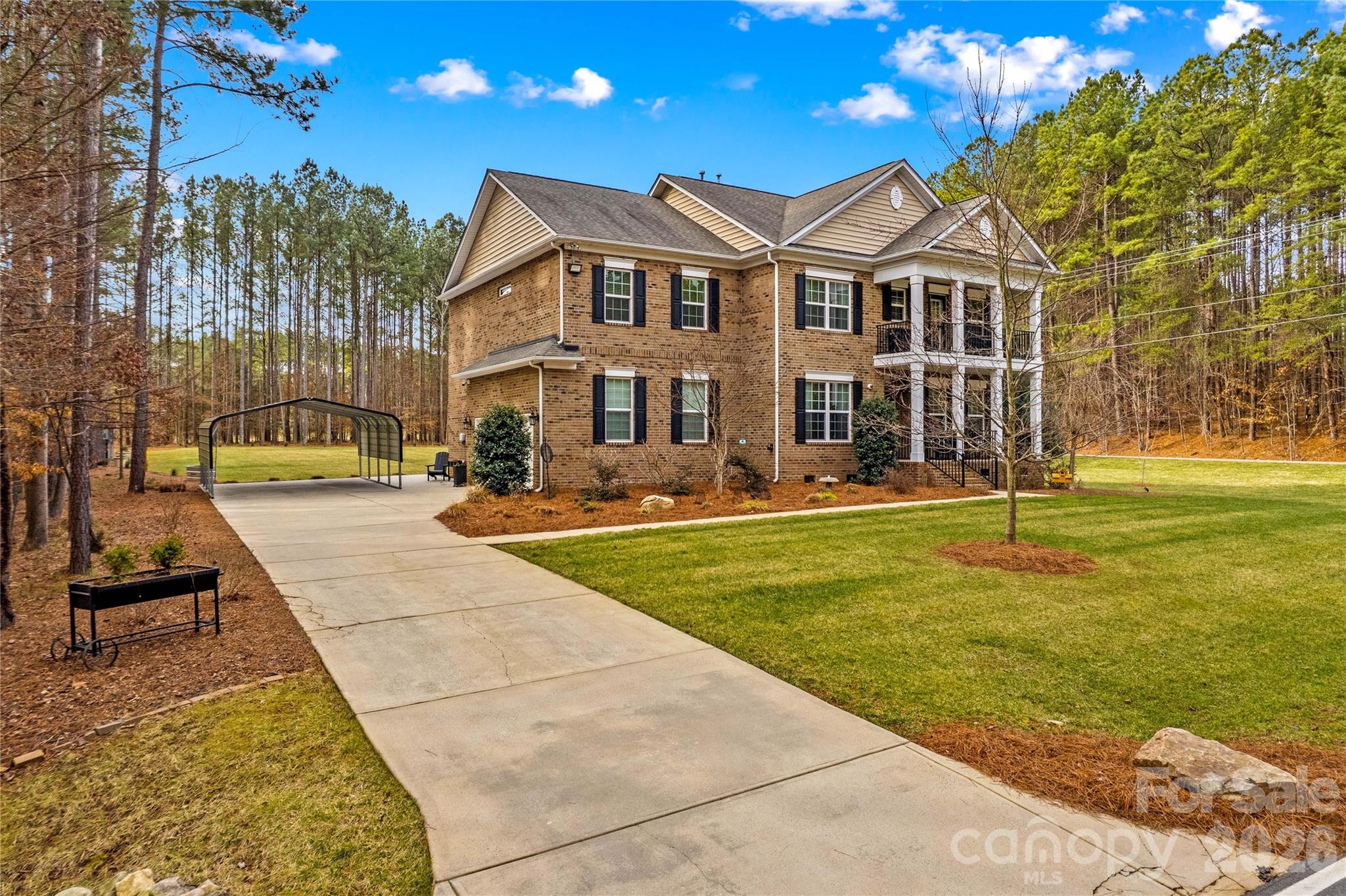 106 Dayvault Cut Road Troutman, NC 28166 - Photo 38 of 48 a front view of a building with a garden