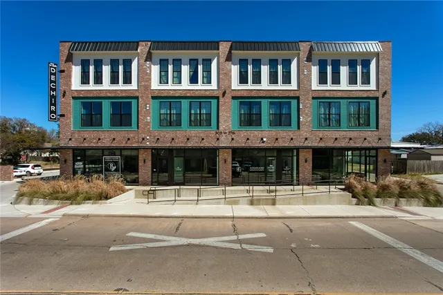 a view of a building with a street
