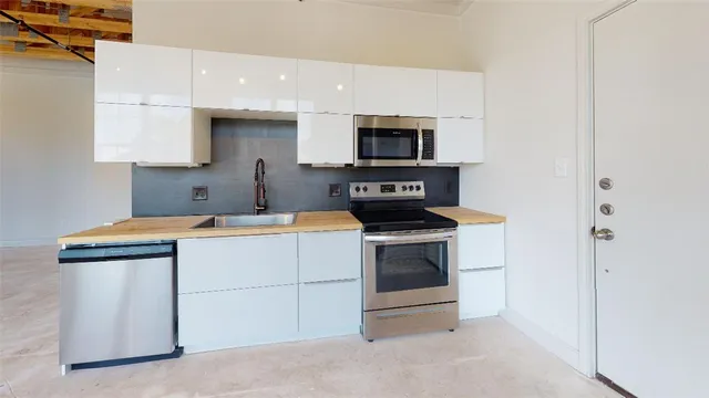 a kitchen with a stove and a microwave