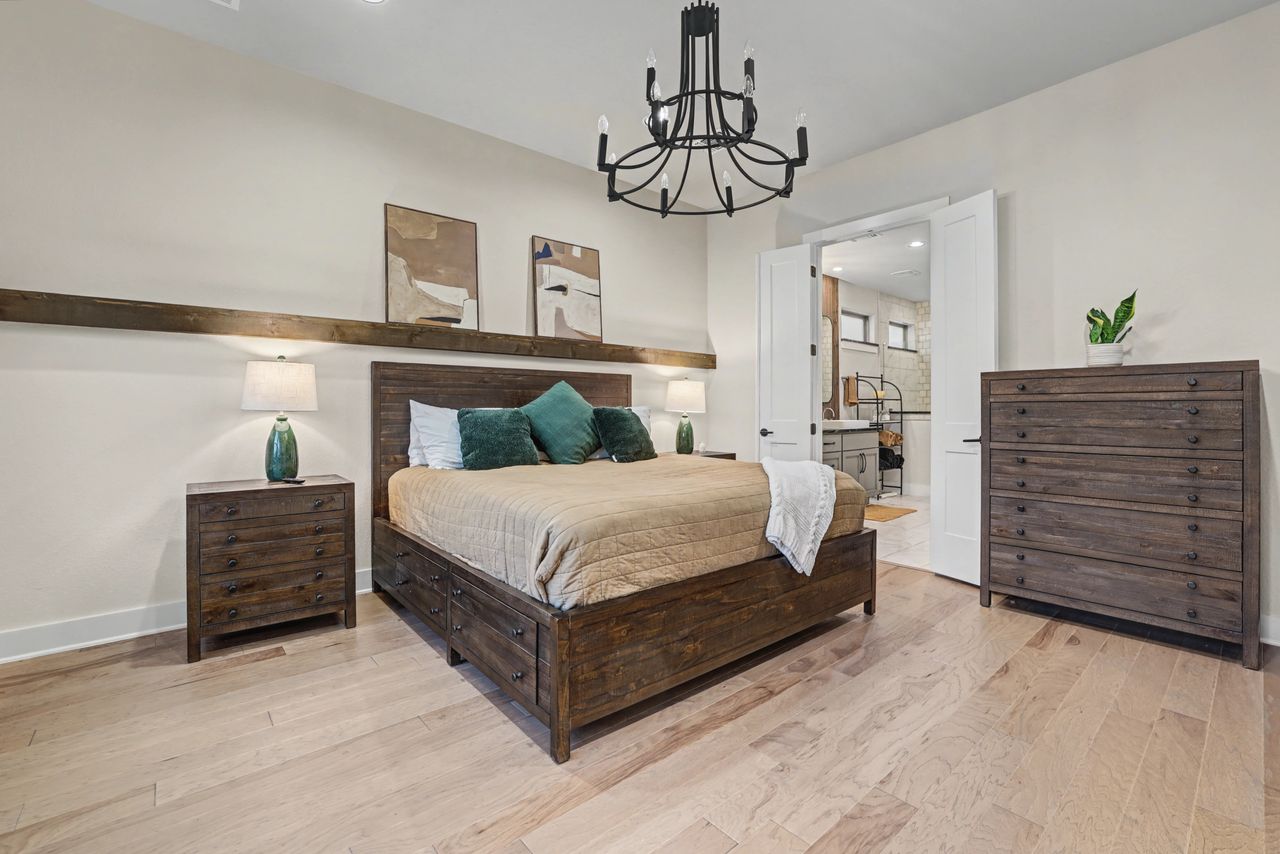 2408 Nate's Place Georgetown, TX 78633 - Photo 17 of 40 Bedroom featuring a chandelier and light wood-style floors
