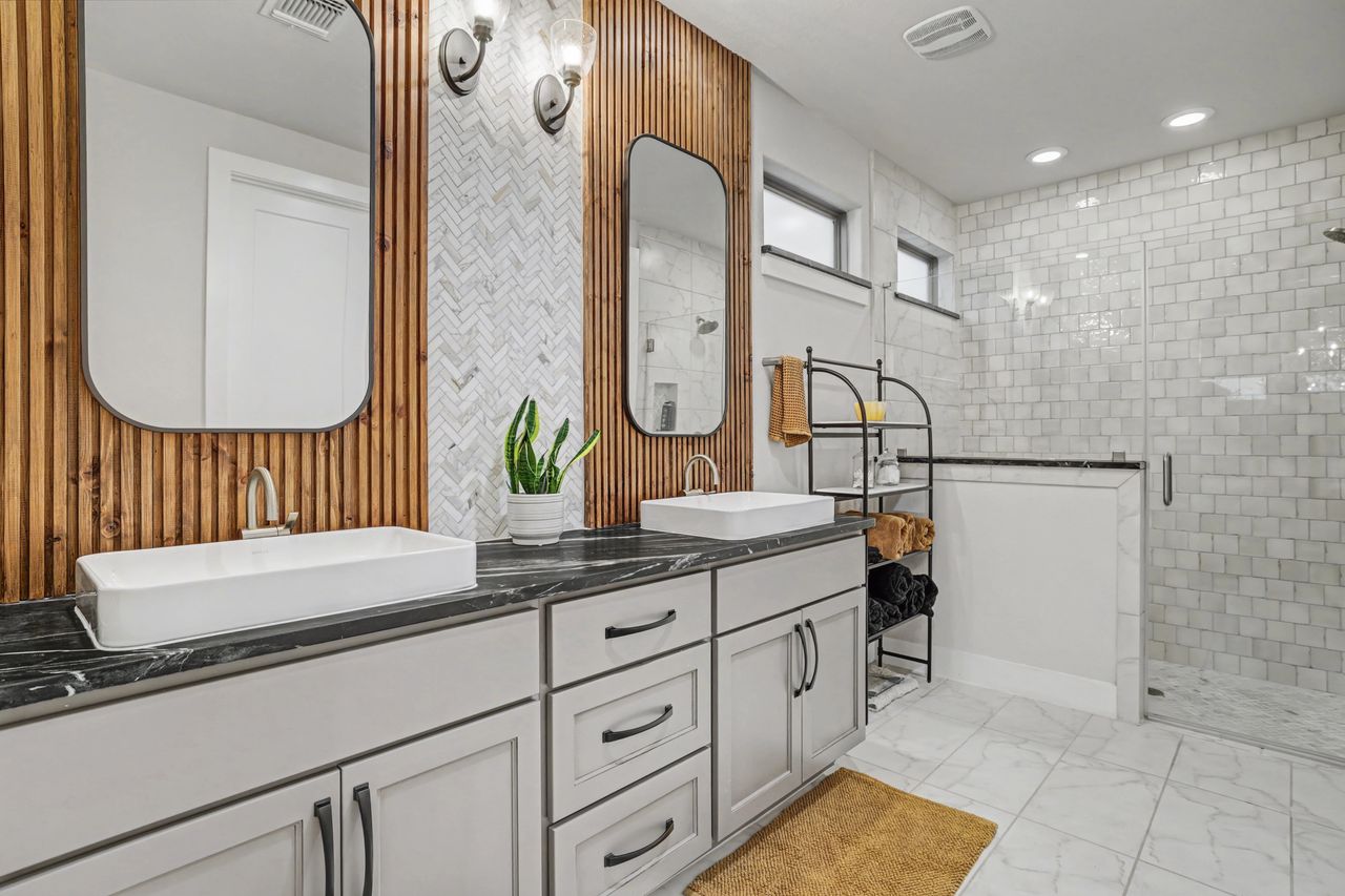 2408 Nate's Place Georgetown, TX 78633 - Photo 20 of 40 Bathroom featuring a stall shower, double vanity, and light marble finish flooring