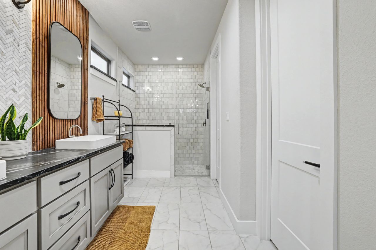 2408 Nate's Place Georgetown, TX 78633 - Photo 22 of 40 Full bathroom with a stall shower, double vanity, light marble finish flooring, and recessed lighting