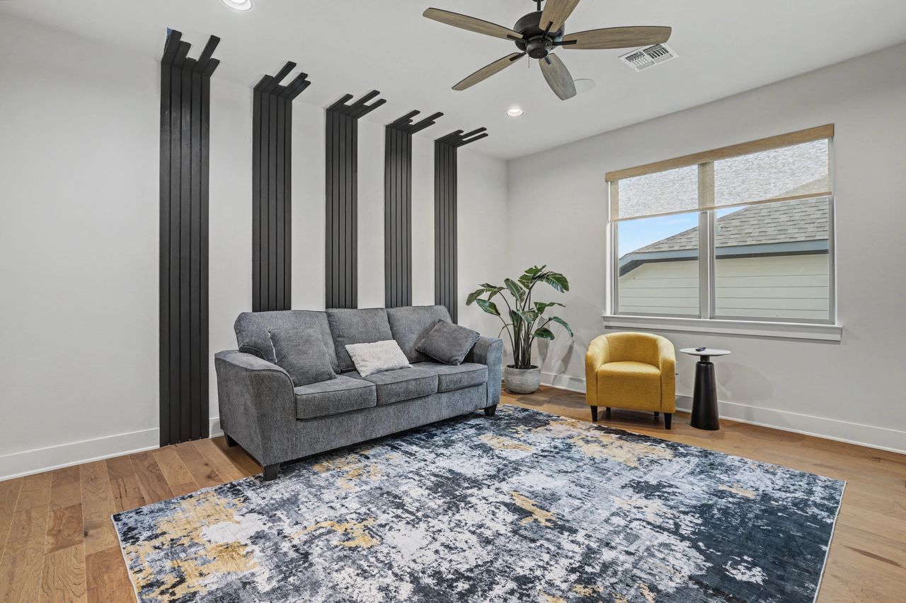 2408 Nate's Place Georgetown, TX 78633 - Photo 29 of 40 Living area with light wood finished floors, ceiling fan, and recessed lighting