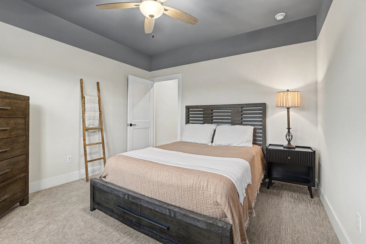 2408 Nate's Place Georgetown, TX 78633 - Photo 30 of 40 Carpeted bedroom with a ceiling fan and baseboards