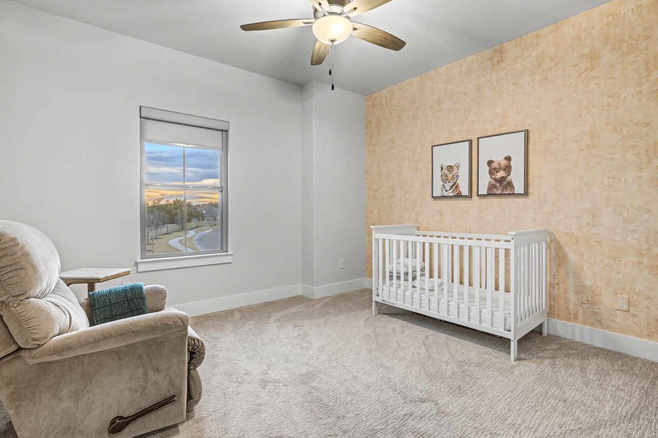 2408 Nate's Place Georgetown, TX 78633 - Photo 35 of 40 Bedroom featuring a nursery area, carpet flooring, and ceiling fan