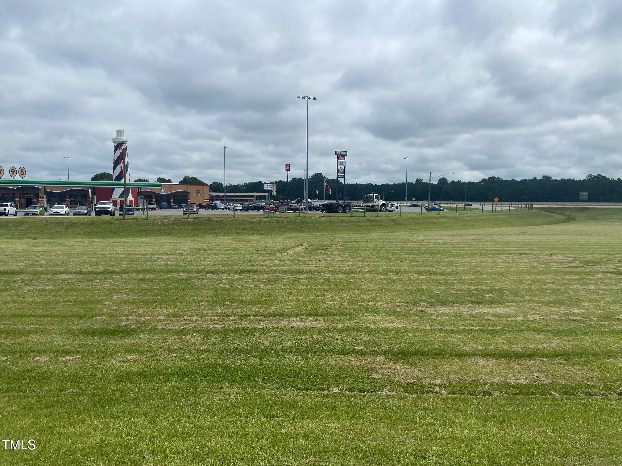 Tbd Truckstop Road Kenly, NC 27542 - Photo 4 of 12 a view of a water with a big yard and a large trees
