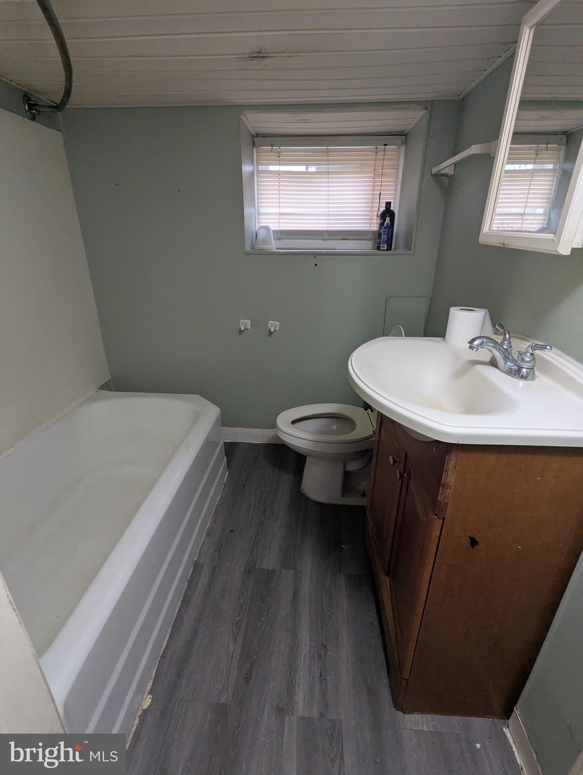 4133 Eierman Avenue Baltimore, MD 21206 - Photo 18 of 23 a bathroom with a sink toilet and mirror