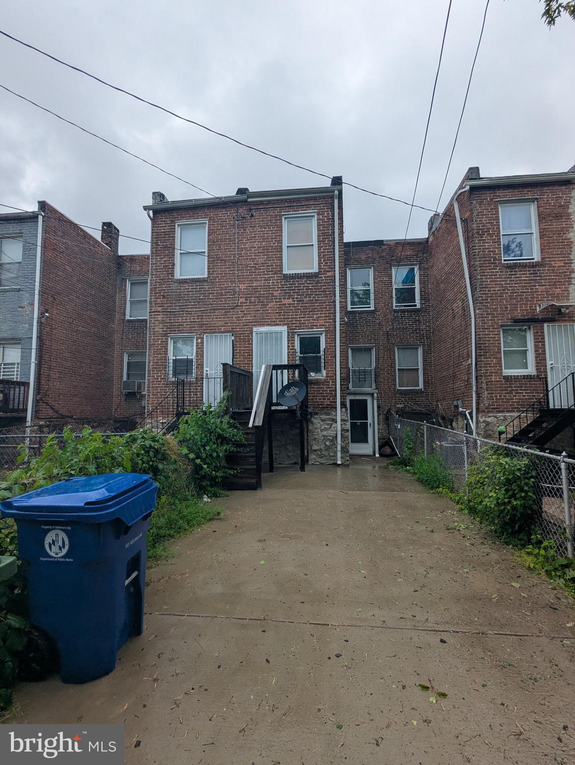 4133 Eierman Avenue Baltimore, MD 21206 - Photo 23 of 23 a brick building with a bench in front of it