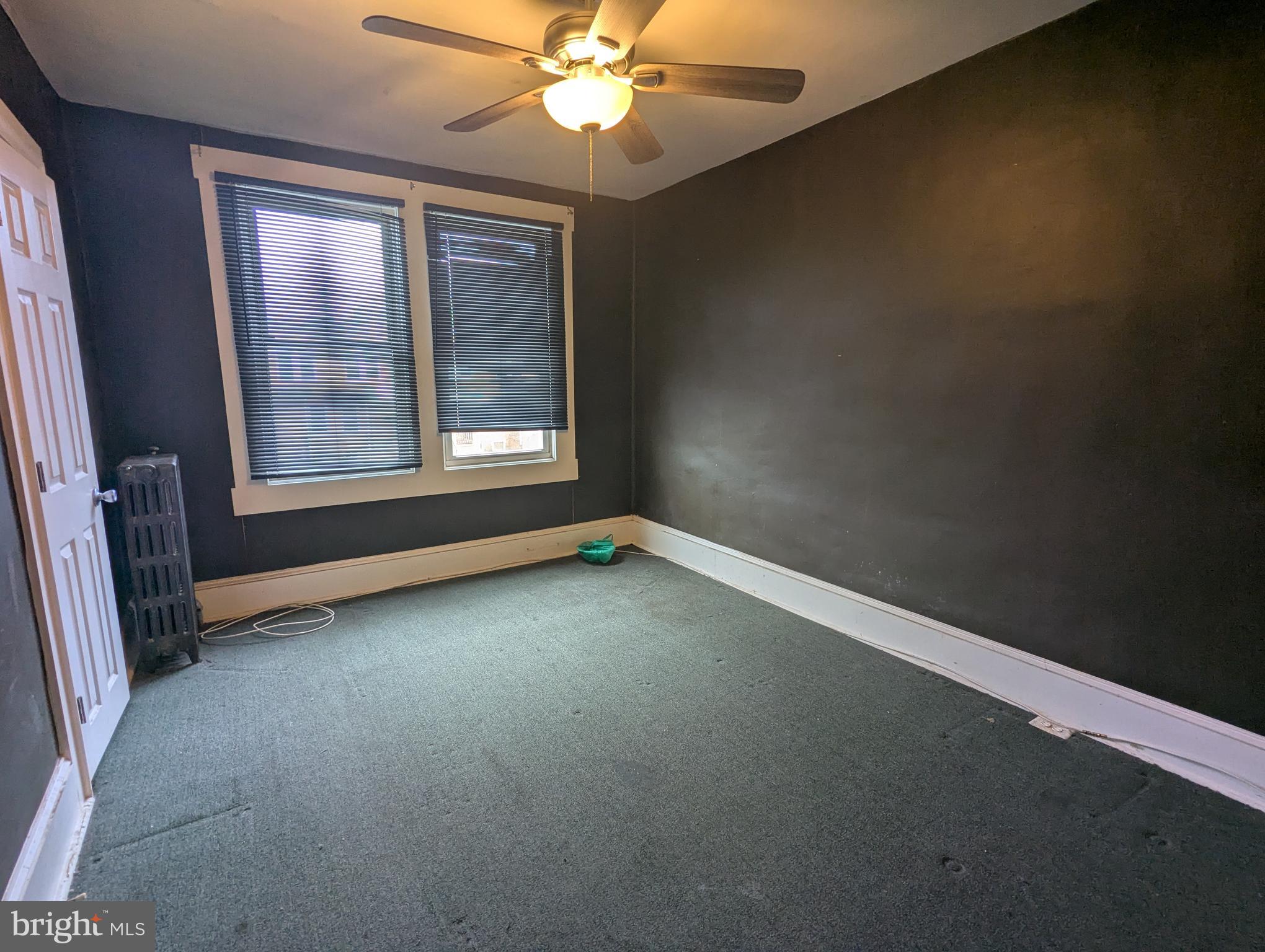 4133 Eierman Avenue Baltimore, MD 21206 - Photo 10 of 23 an empty room with windows and fan