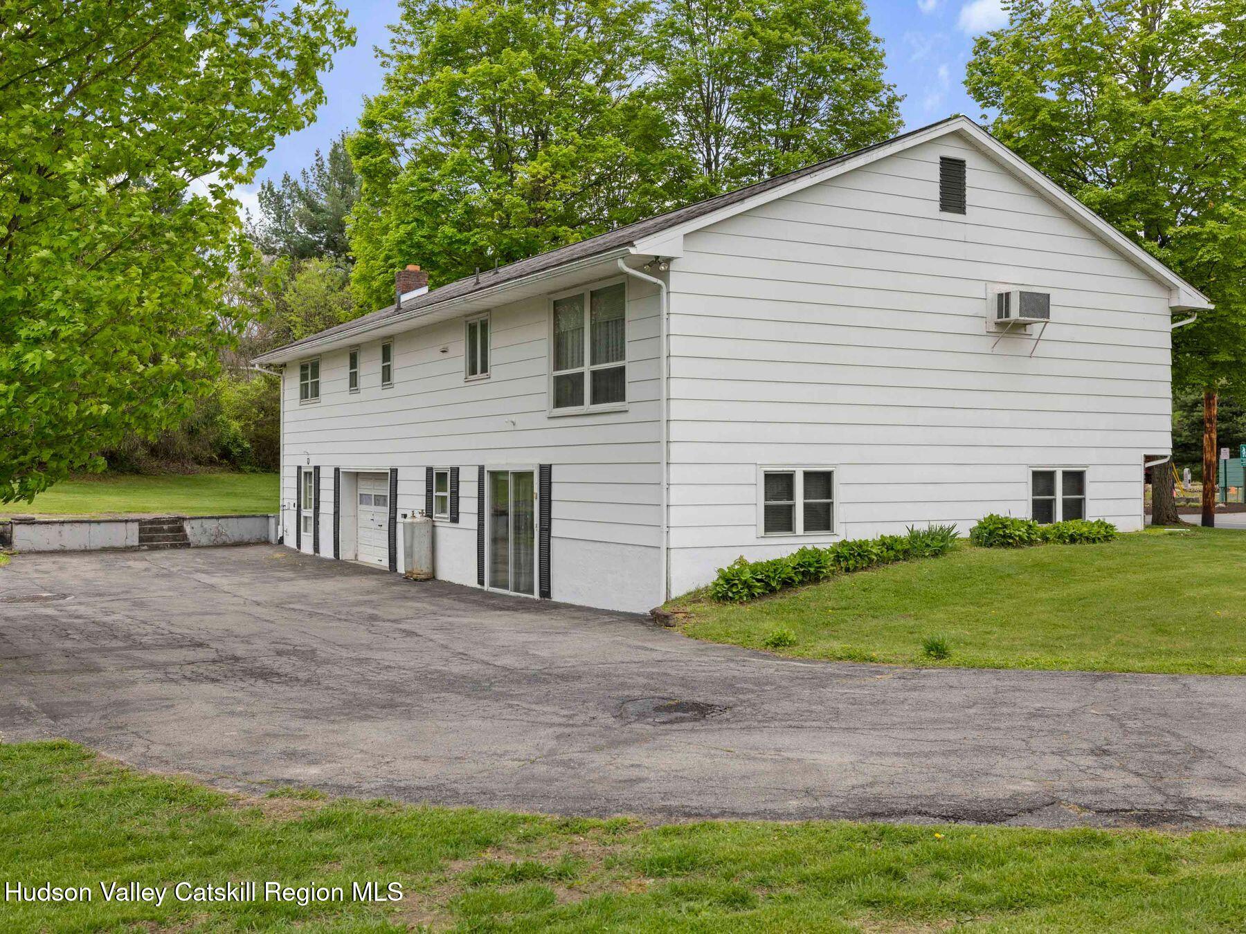 104 New Paltz Road Highland, NY 12528 - Photo 36 of 43 a view of a house with a yard and a garage
