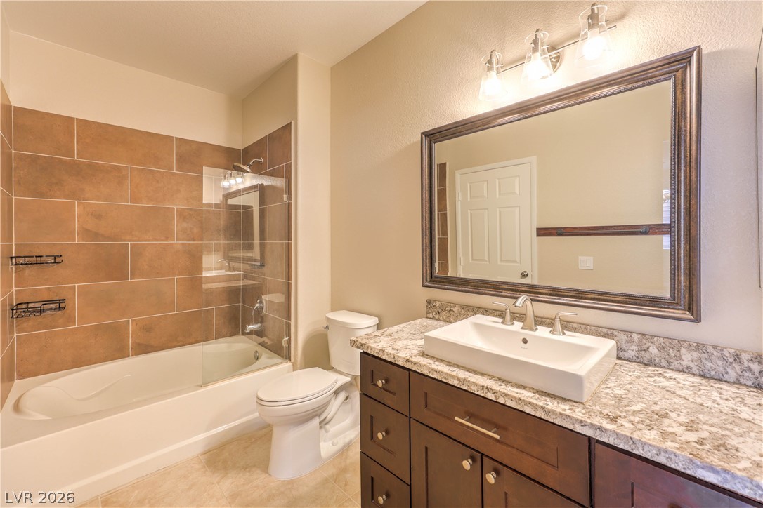 9050 West Warm Springs Road, Unit 2033 Las Vegas, NV 89148 - Photo 20 of 30 A well-appointed bathroom with a spacious shower and a vanity featuring a vessel sink.