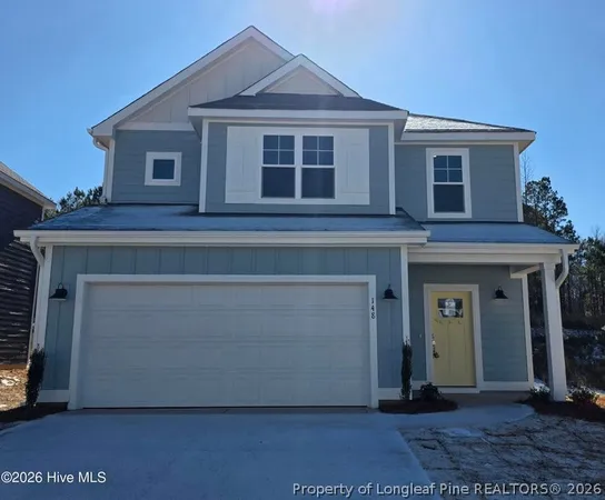 a front view of a house with a garage