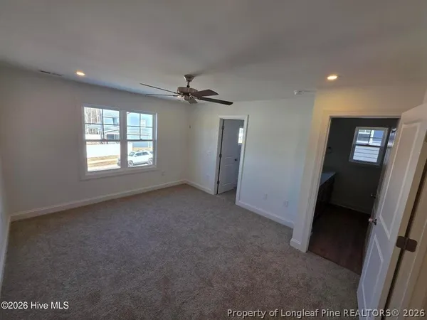a spacious bathroom with a sink a mirror and a vanity