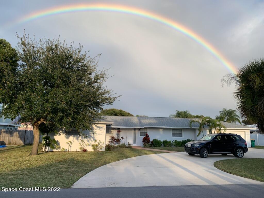 9 West Point Drive Cocoa Beach, FL 32931 - Photo 2 of 28 a view of street with parked cars