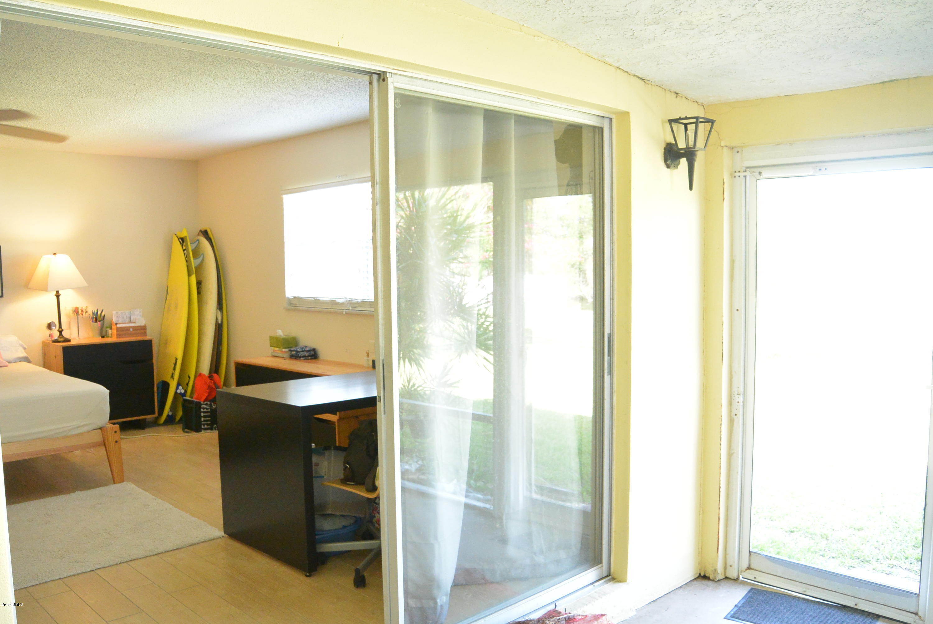 9 West Point Drive Cocoa Beach, FL 32931 - Photo 21 of 28 a bathroom with a sink and a mirror