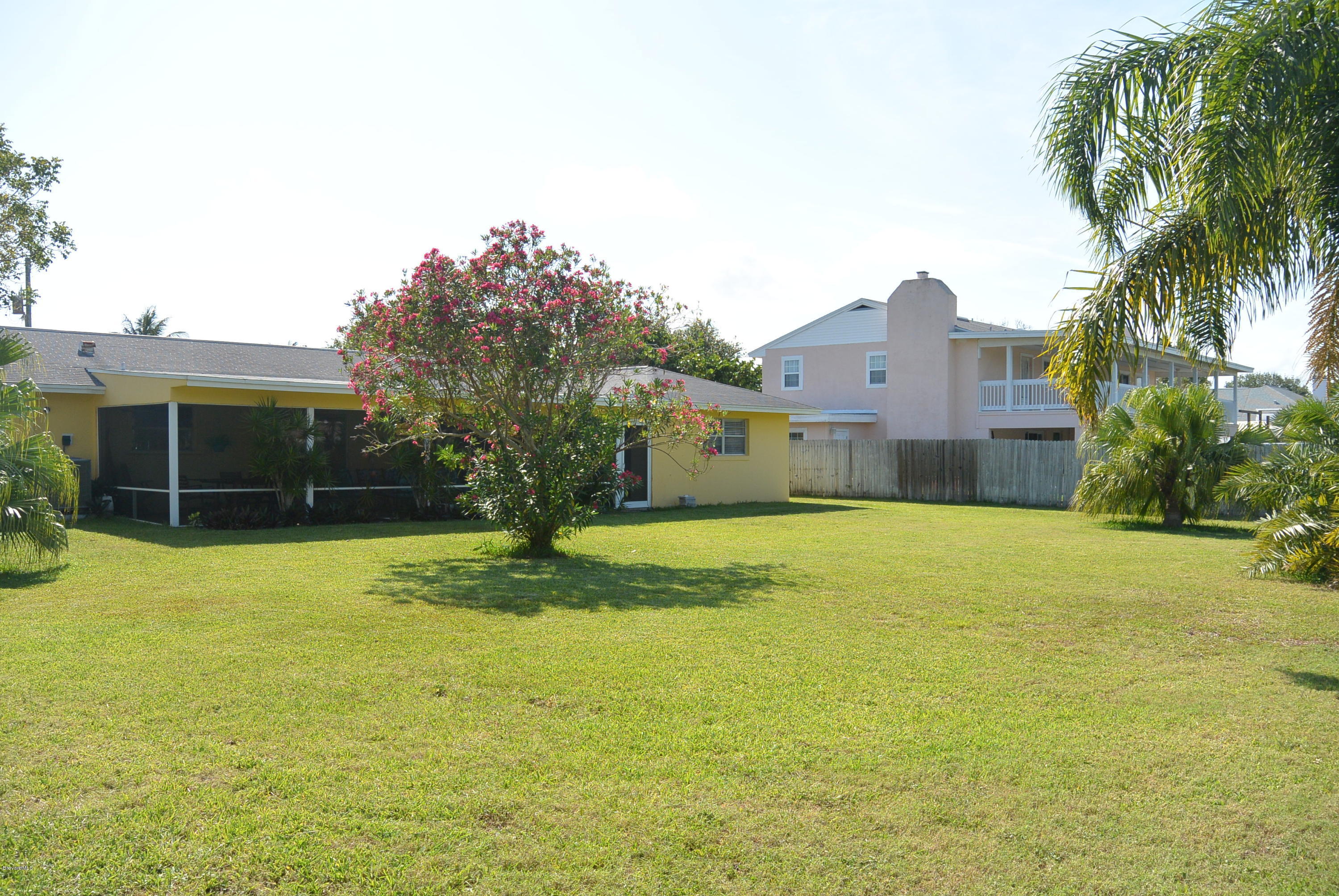 9 West Point Drive Cocoa Beach, FL 32931 - Photo 24 of 28 a view of a house with pool and a yard