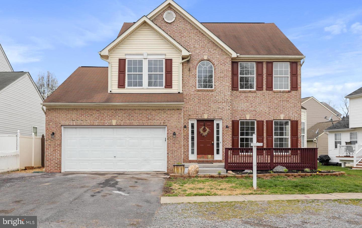 131 Ranson Estates Circle Ranson, WV 25438 - Photo 2 of 2 a front view of a house with garden