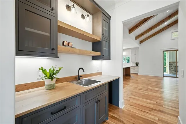 a view of a kitchen with a stove cabinets and wooden floor