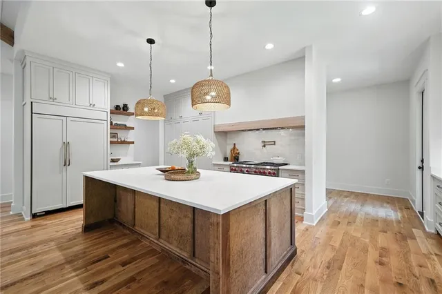 a bathroom with double sink and a mirror