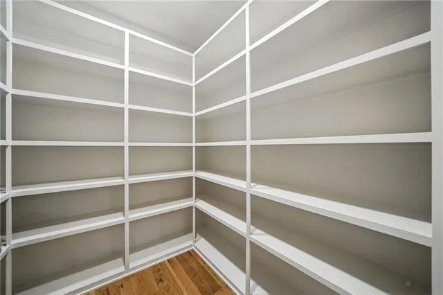 a room with a bed and a walk in closet