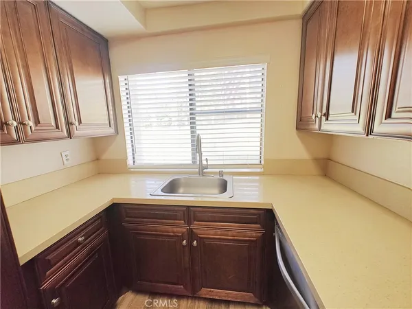 a kitchen with a sink and a window