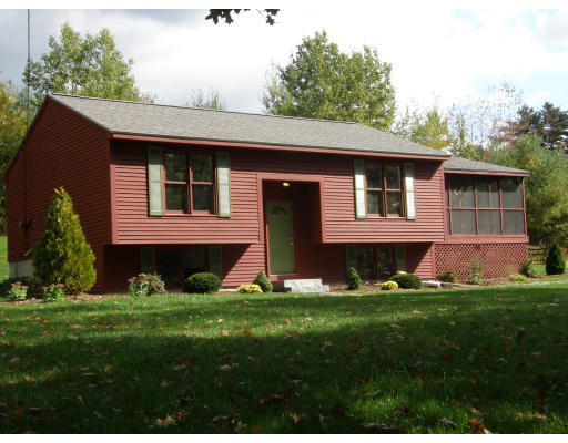 217 Brickyard Road Athol, MA 01331 - Photo 1 of 14 a front view of a house with a yard and garage